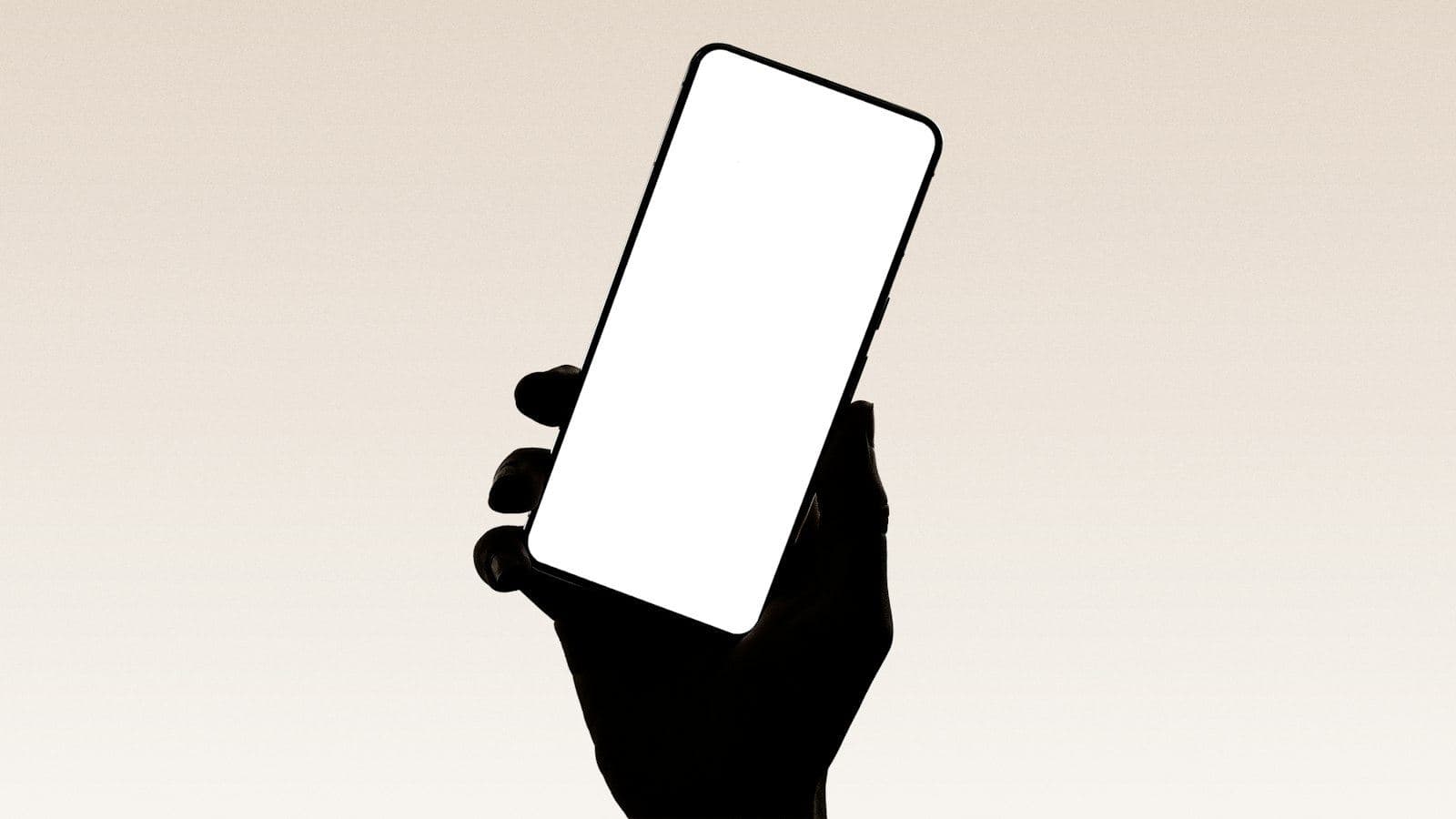 A hand holding a smartphone with a blank app screen
